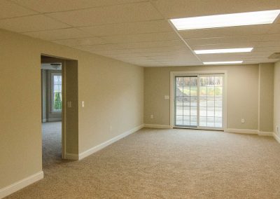 finished basement with sliding glass door