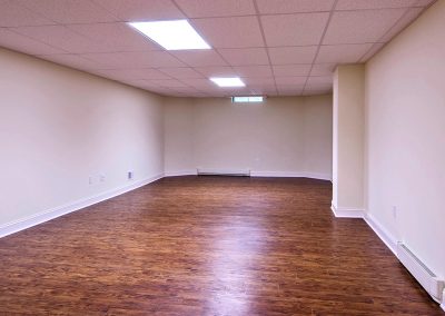 full basement with hardwood flooring
