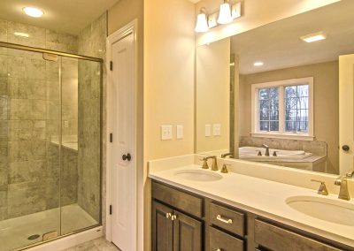 tiled shower corner tub and double vanity