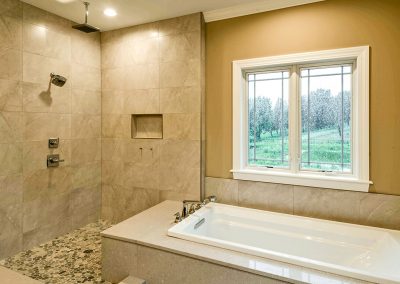 custom tub and tiled shower