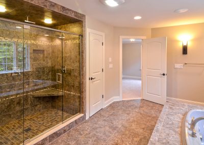 large walk in shower with bathtub