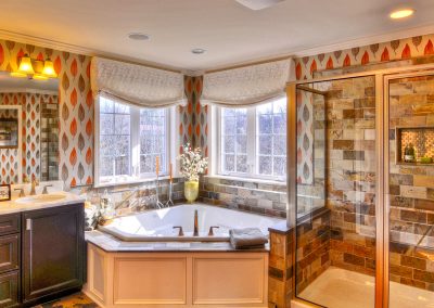 double vanity with tiled shower and corner tub