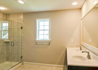 double vanity and tiled shower