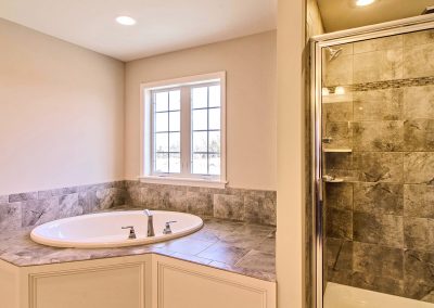custom bath tub platform and tiled shower