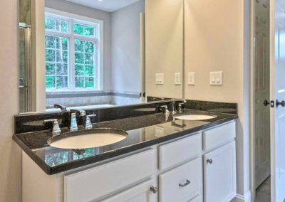 white double vanity with large mirror