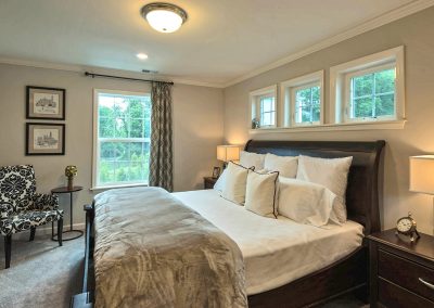 furnished bedroom with transom windows
