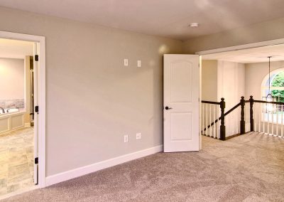 double doors to carpeted bedroom