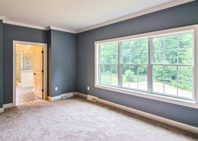 carpeted bedroom with blue walls