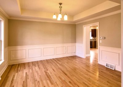 dining room with hardwood and tray ceiling