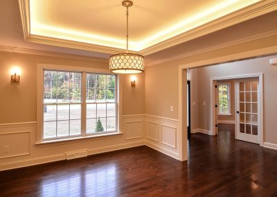 dining room with illuminated tray ceiling