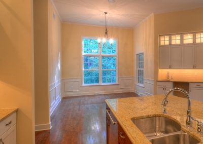 dining area with wet bar and wall molding