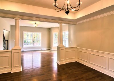 dining room with columns and tray ceiling