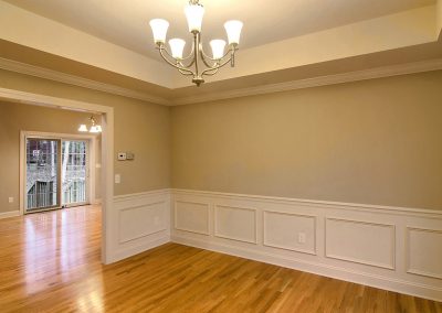 dining room with wall molding and tray ceiling