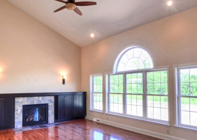 windows with arched transom and fireplace