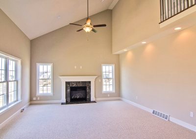 vaulted ceiling and fireplace in family room