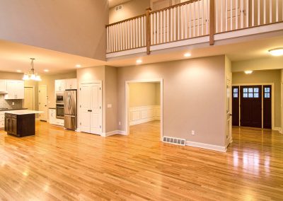 upper floor balcony overlooking two story family room