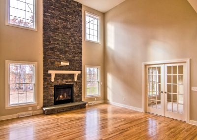 two story stone fireplace and double french doors