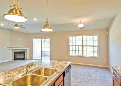 open plan living area with corner fireplace