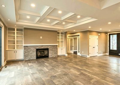 custom family room with coffered ceiling