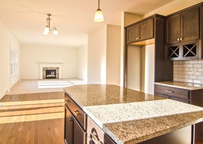 kitchen dining and family room with fireplace