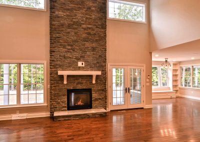 two story stone fireplace with double french doors