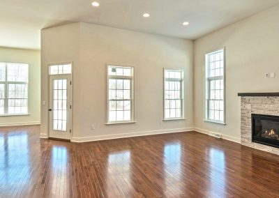 open plan dining and family room with fireplace and french door