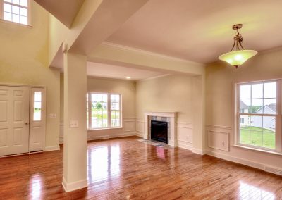 open plan dining and living room with fireplace