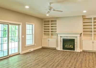 hardwood family room with fireplace and custom built ins