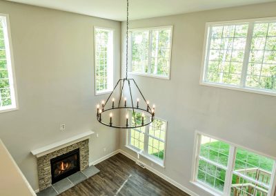 two story family room with many windows
