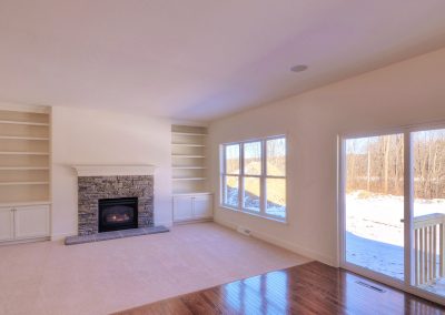custom shelving and fireplace in family room