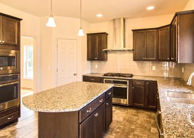dark kitchen with rounded island