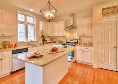 white kitchen with double door pantry