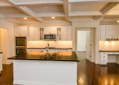 white kitchen with custom work station
