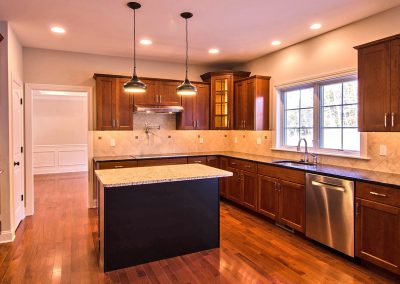 dark kitchen with pot filler