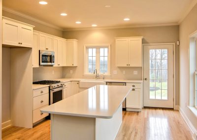 white kitchen with windows and exterior french door
