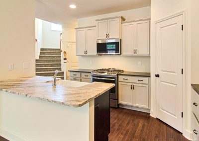 white kitchen with corner pantry