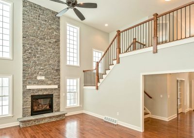 family room with balcony railing