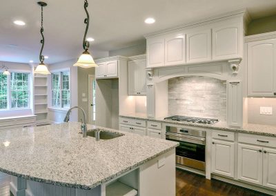 custom white kitchen with large island