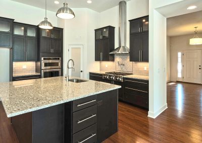 dark kitchen with granite countertops