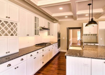 white cabinets with coffered ceiling