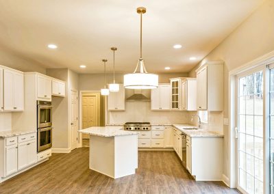 white kitchen with angled island