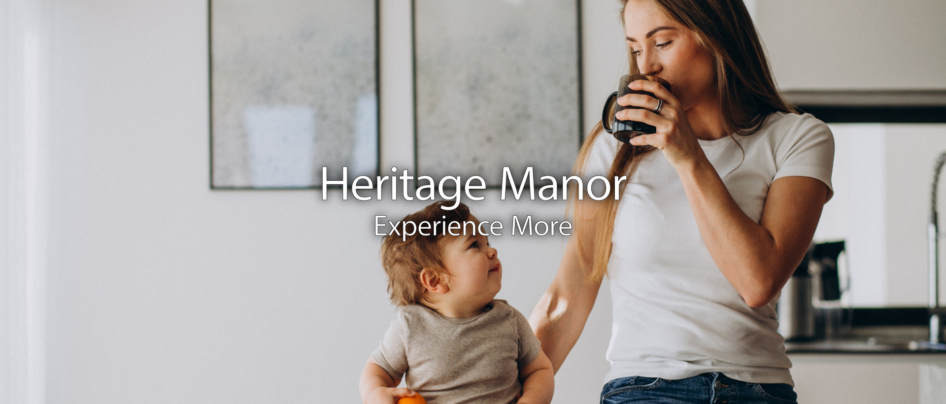 older couple smiling in their kitchen and enjoying life at heritage manor